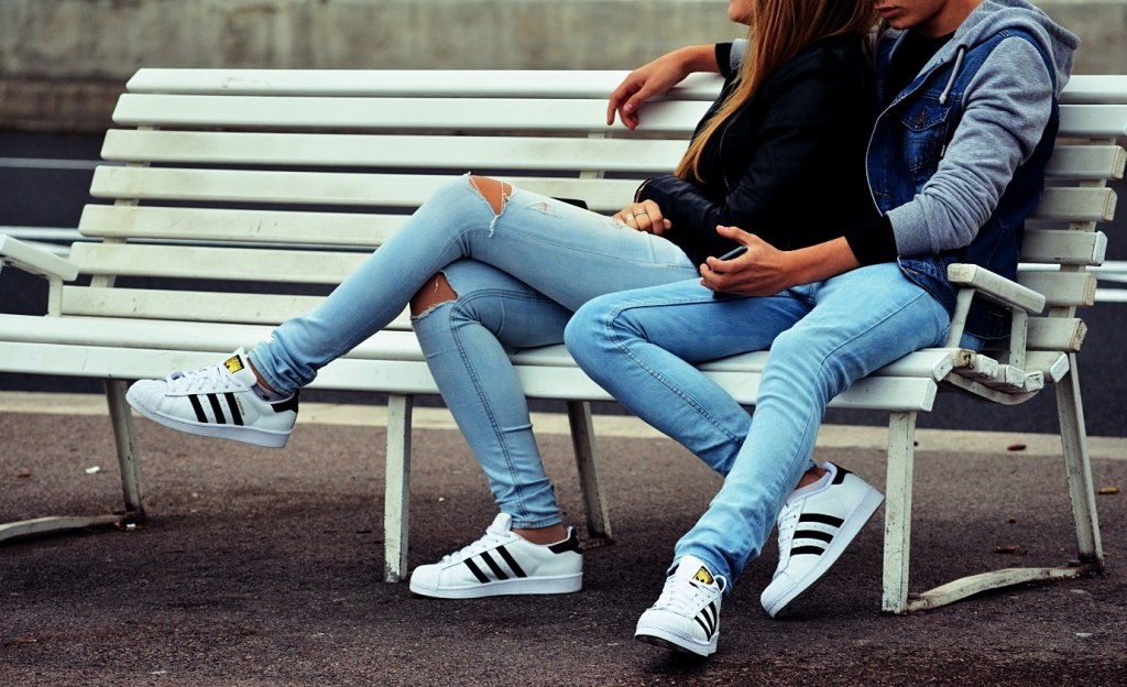 a couple sitting on a bench