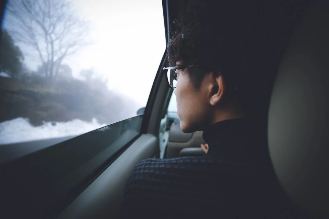 A private investigator observing from a parked car