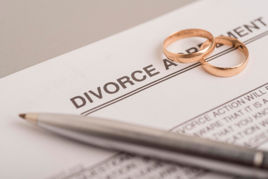 wedding rings on a divorce agreement