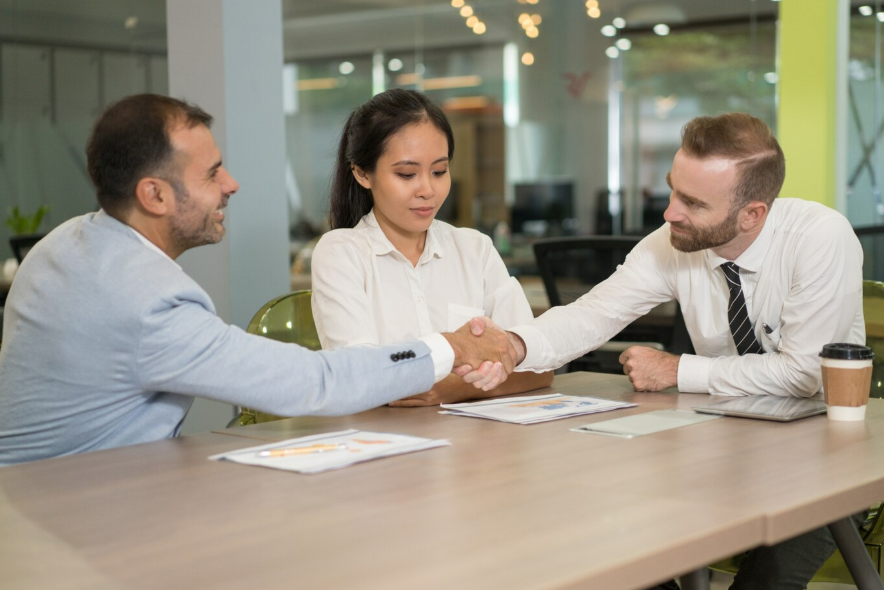 employees shaking hands