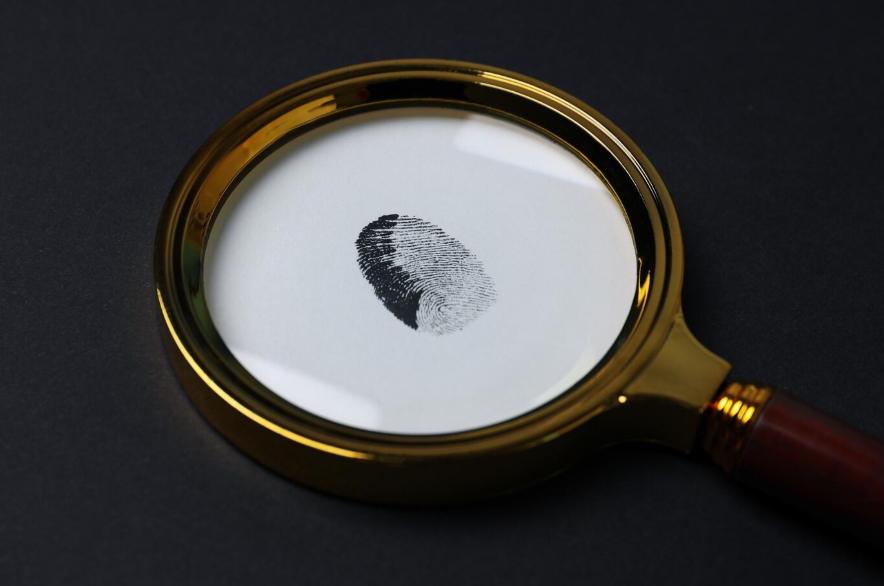 a magnifying glass with fingerprints