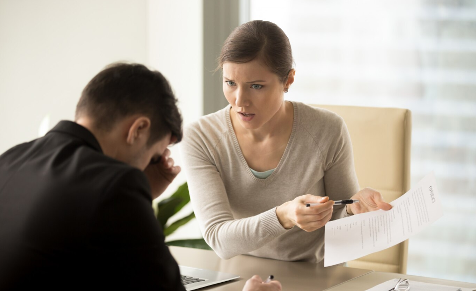 a woman talking to a man