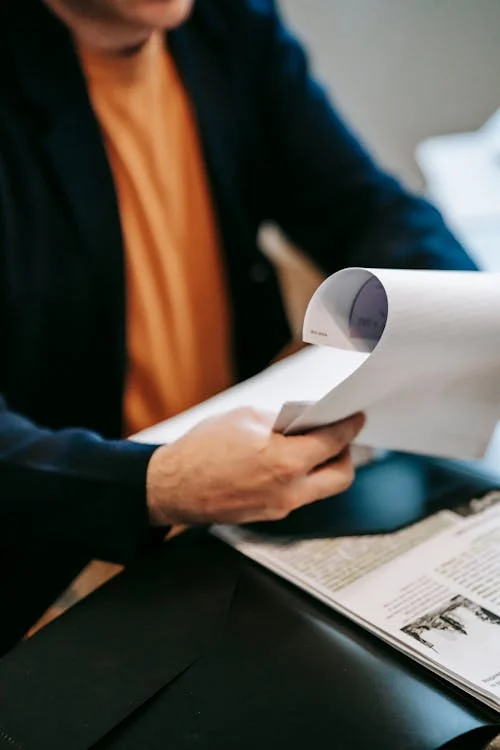 A private investigator reviewing documents related to a custody case