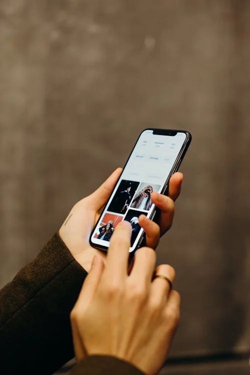 An investigator reviewing photos on a smartphone for a family law case