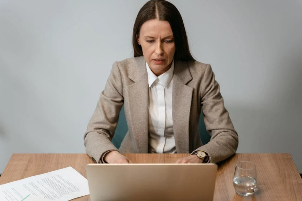 A digital investigator analyzing social media profiles on a computer