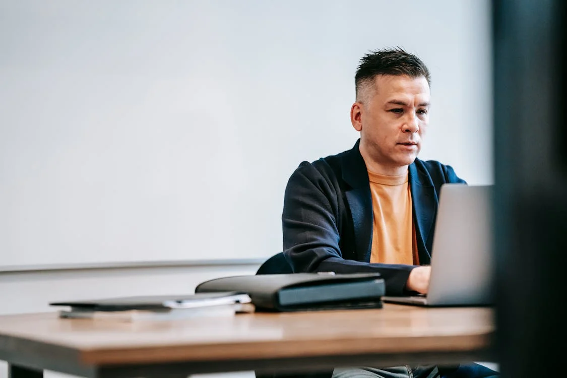 A private investigator analyzing digital evidence on a laptop